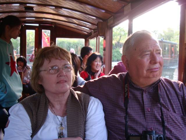 Jim and Janet enjoy the boatride through the wetlands.  Hangzhou, China