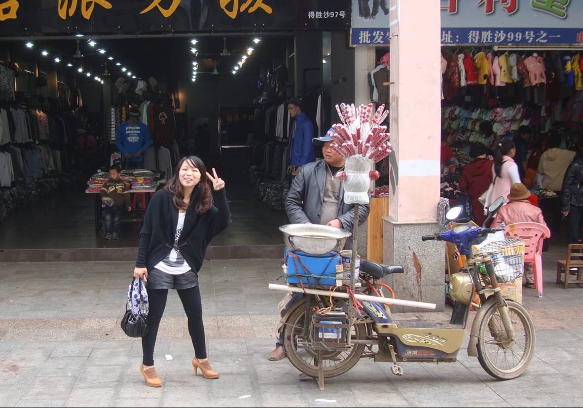 Picture:  The girl just likes to get her picture taken.  Haikou on Hainan Island, China