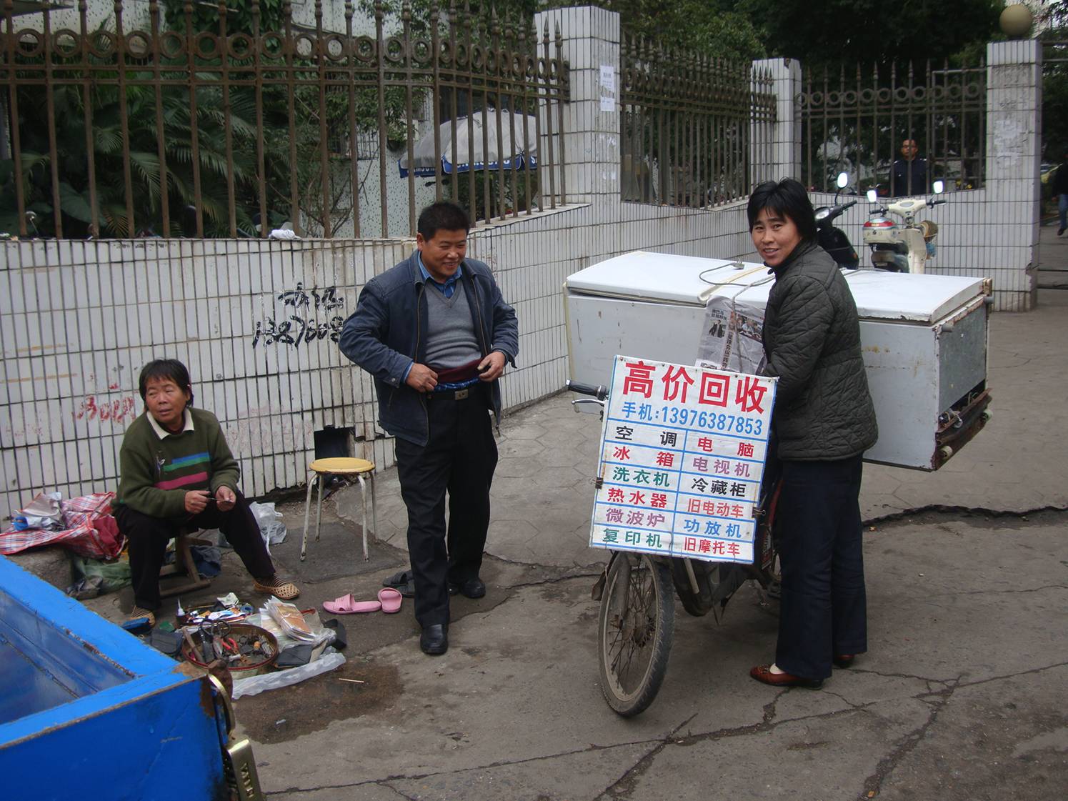 Picture:  Moving the refrigerator on the bicycle.  Haikou, China.