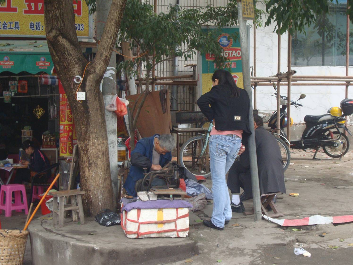 Picture:  Bike repair on the streets of Haikou, Hainan Island, China.