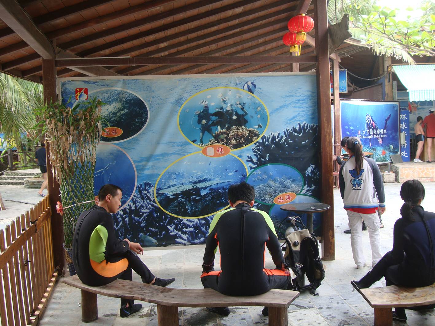 Picture;  Tourists dressed for scuba dragging.  Da Dong Hai, Hainan Island, China