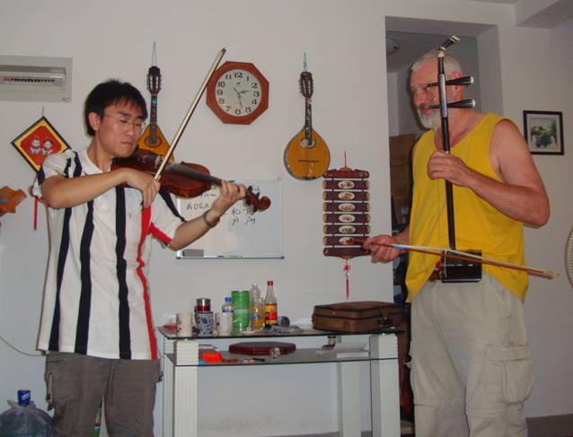 And he even plays the violin!  Wonderful to hear the violin and erhu played together.