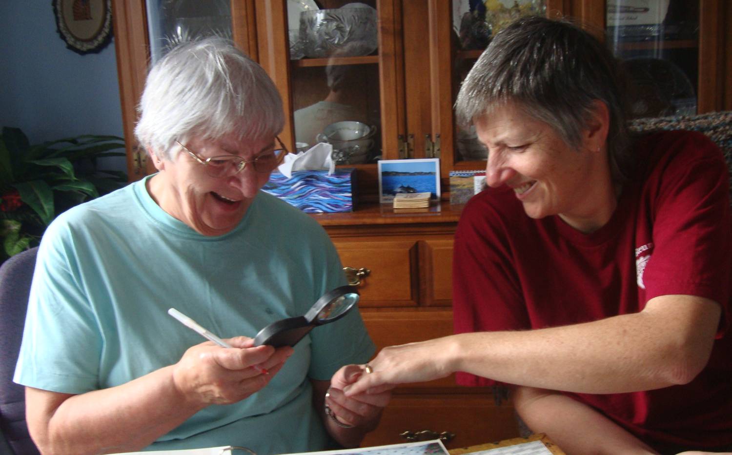 Ruth's mom checks out the engagement ring. Okay, the magnifying glass was my idea.