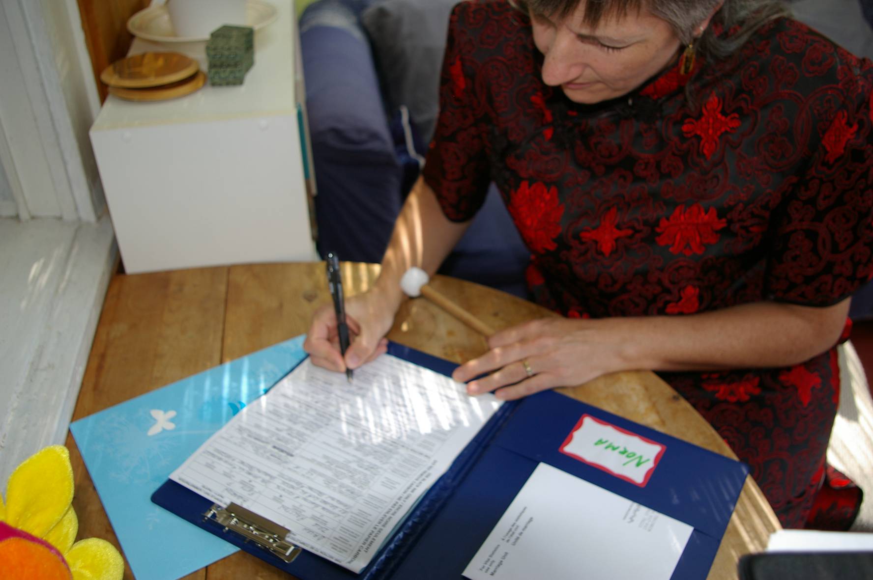 Ruth signs the marriage form.