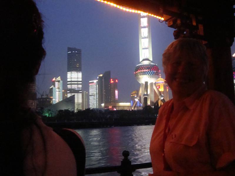 That's the Pearl Tower in the background.  Night cruise on the Huang Pu,  Shanghai,  China