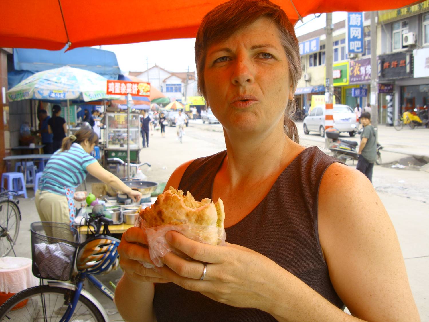 Ruth Anderson enjoys the street food in Wuxi,  Jiangsu,  China.  