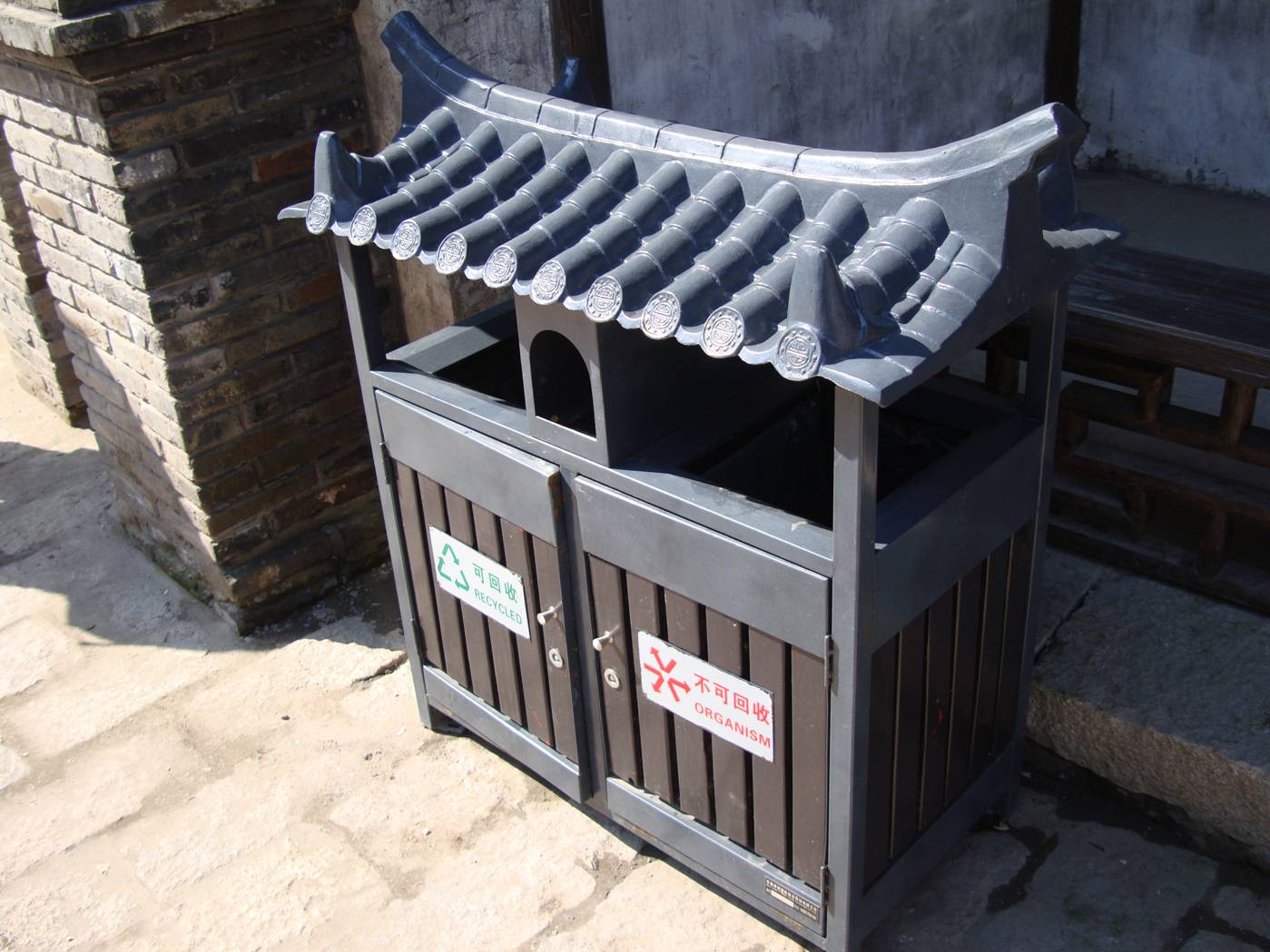 Picture:  The ancient theme is carried into the garbage receptacles, with questionable stylistic success.  Wuxi old city, Wuxi, China