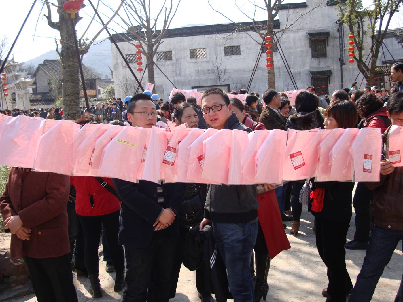 Picture:  So many choices.  How do they ever decide.  Women advertising for a husband in Wuxi, China