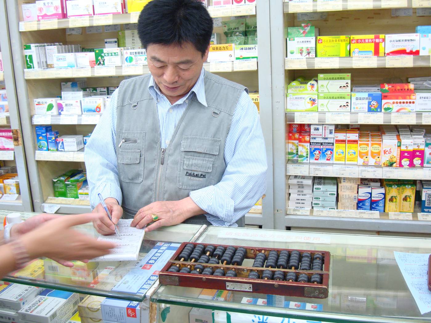 Picture:  Pharmacists with an abacus.  Wuxi, China