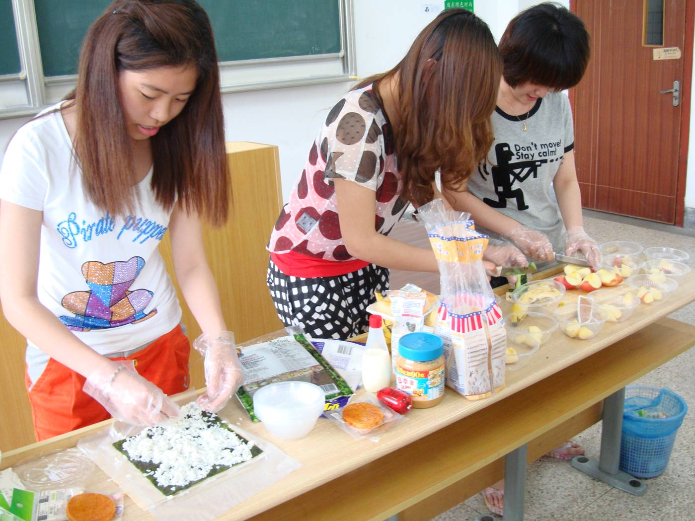 Picture:  Students prepare a fruit salad and sushi as a demonstration project.  North American College of Jiangnan University, Wuxi, China