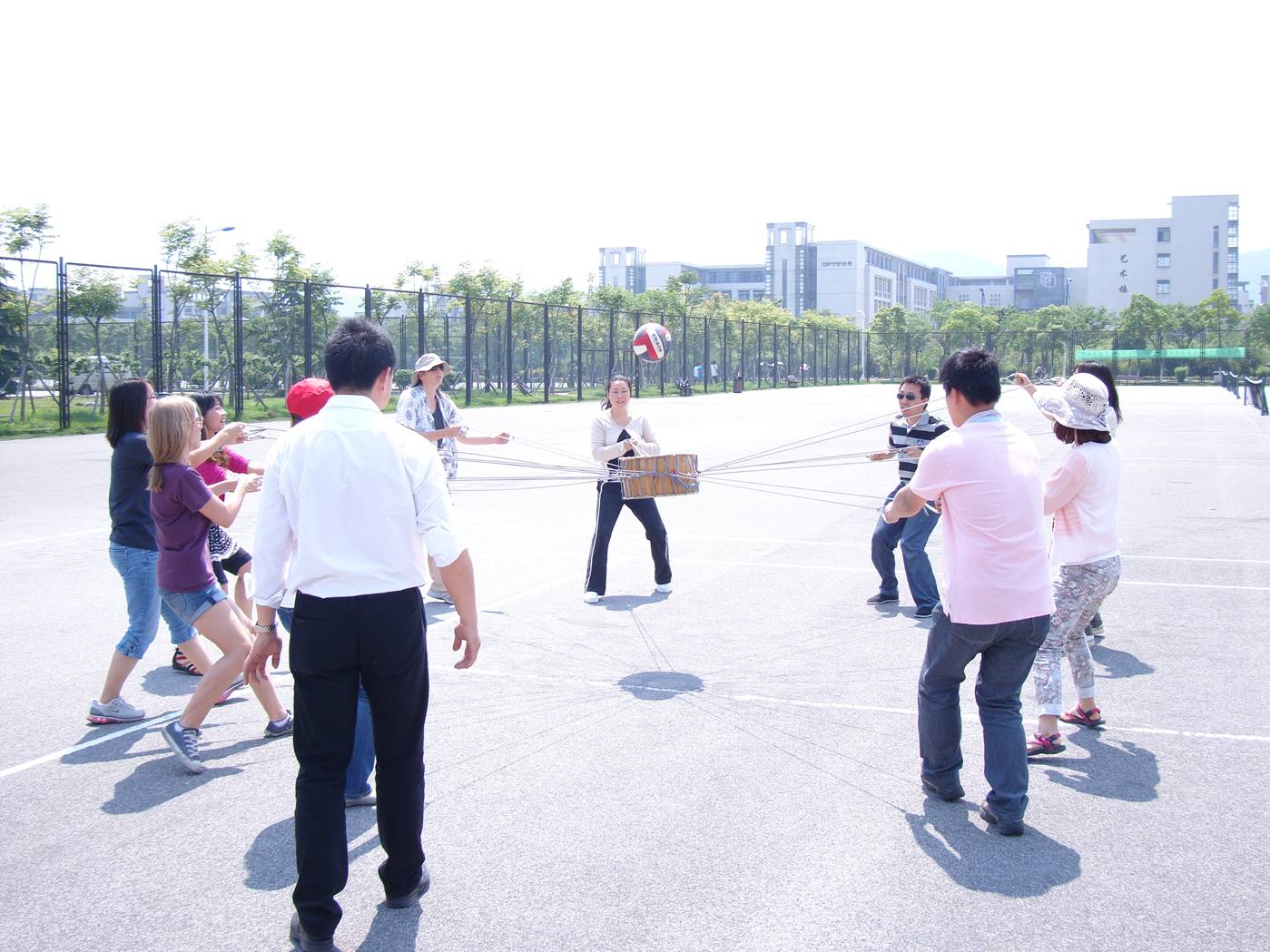 Picture:  A lively game of drum ball. Sports activity day at North American College of Jiangnan University.  Wuxi, China