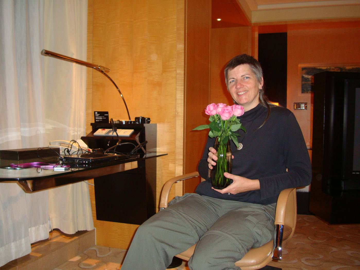 Ruth admires the roses in our room, Le Royal Mridien Shanghai, China