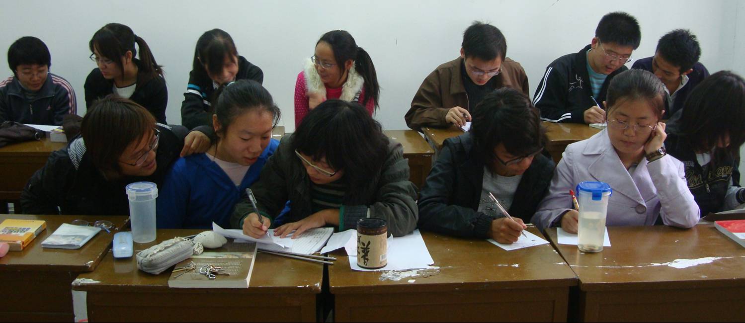 Some of my Oral English freshmen put their heads together.  Jiangnan University, Wuxi, China