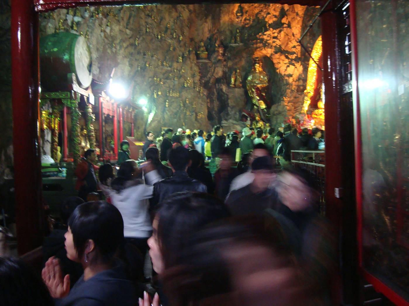 Decorated religion is a huge draw for tourists here.  Inside the mountain temple, Yandang Shan, China