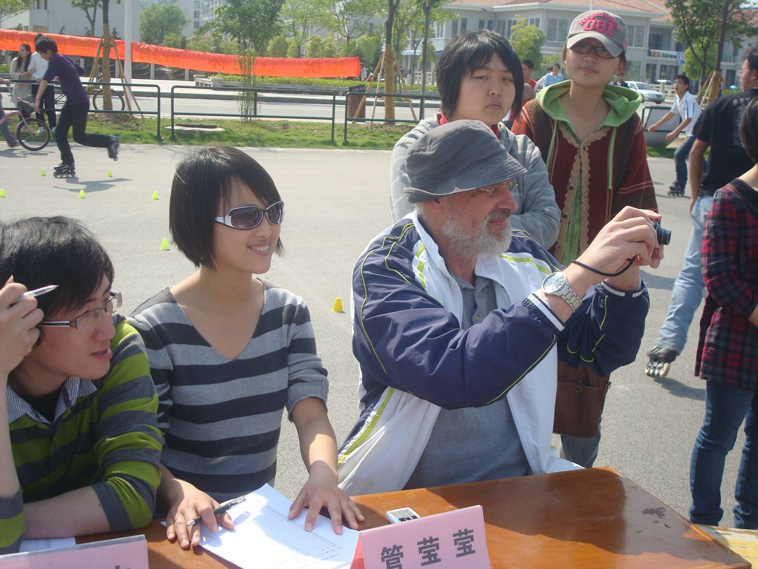 That's Winkle to my left. (I'm the guy with the camera in the Red Green costume.)  Skating competition,  Jiangnan University,  Wuxi,  China