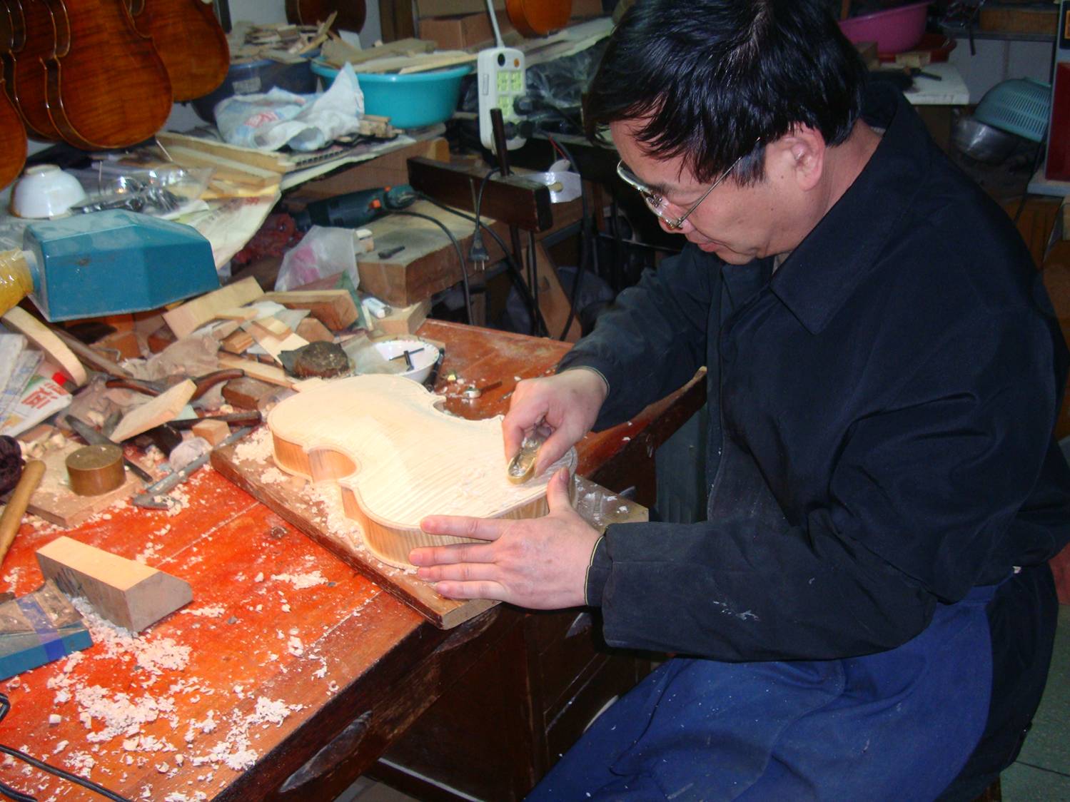 Shanghai master violin maker at work.