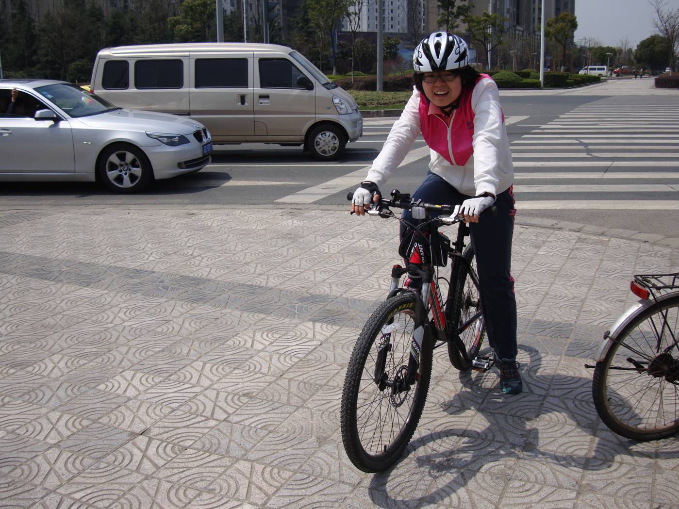 Picture:  Very rare to see a Chinese person wearing a bike helmet.  But this will change.  Wuxi, China