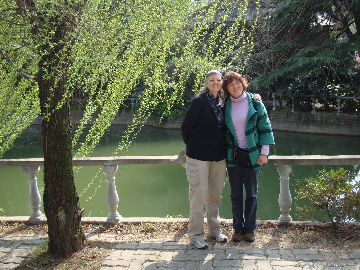 Picture:  Ruth with George's mother under a willow tree.  Yang Shan, Wuxi, China