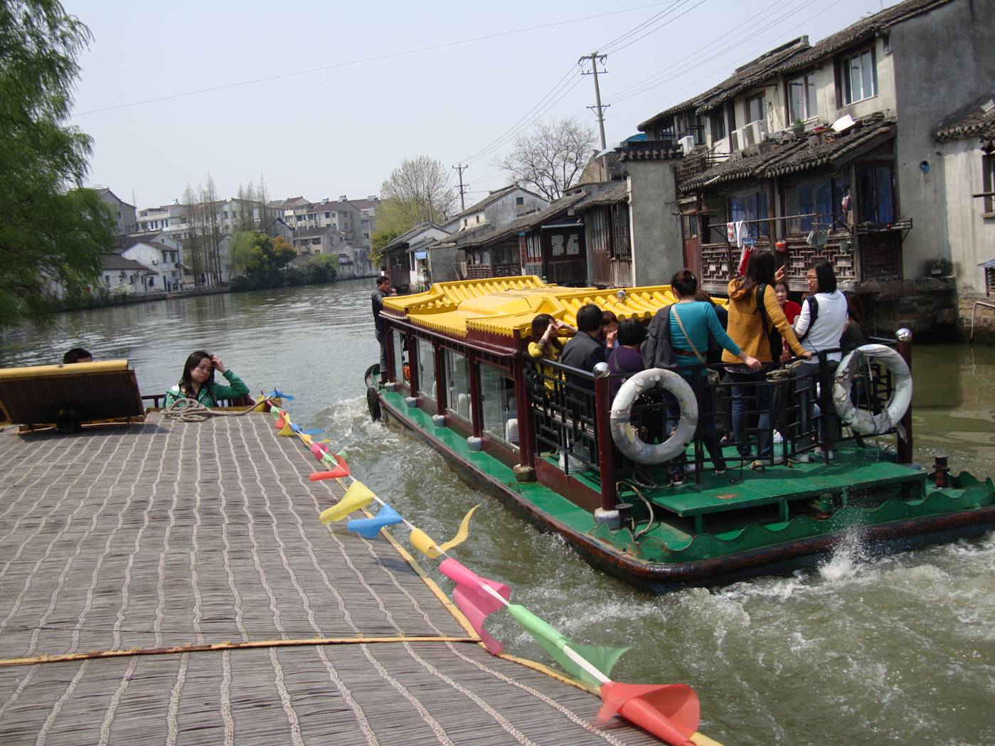 Picture:  We pass another tour boat on the canal.  Suzhou, China