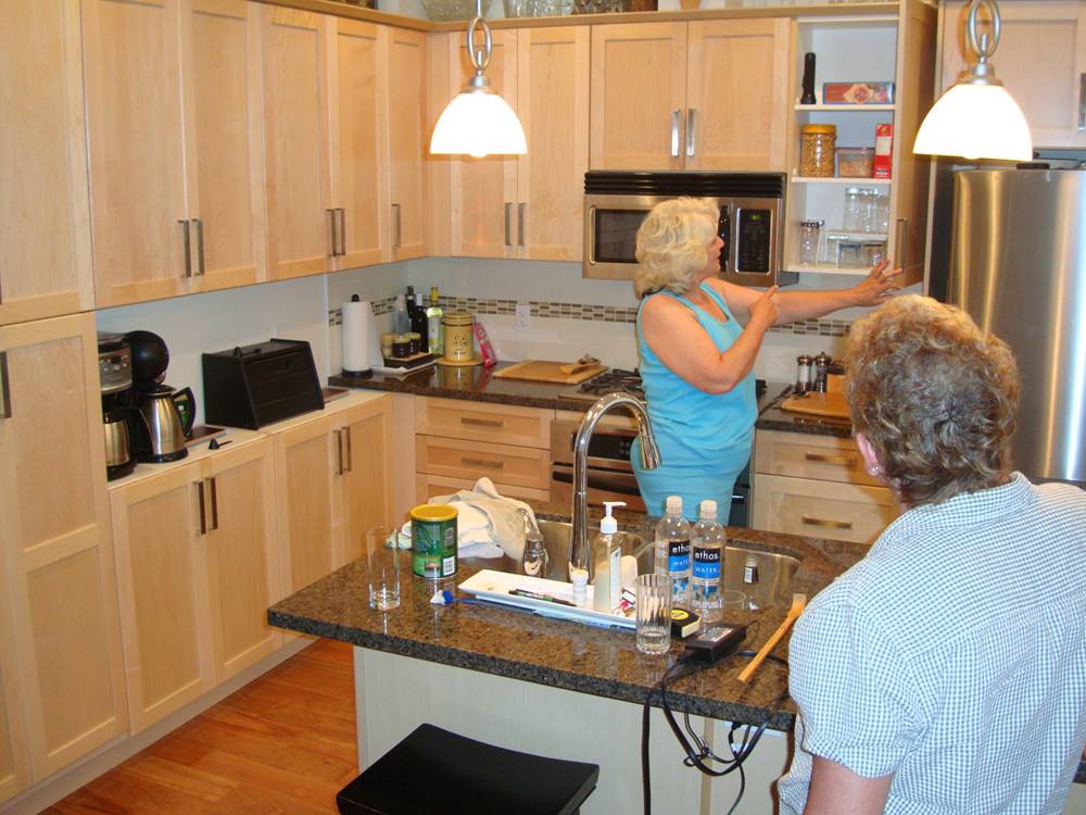 Kathy shows off her new kitchen, in her new condo.  Maple Ridge, B.C., Canada