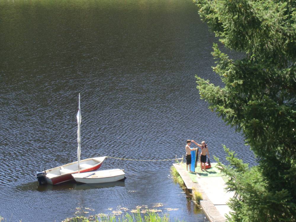 Kiri's older brother and his friend enjoy the lake. 