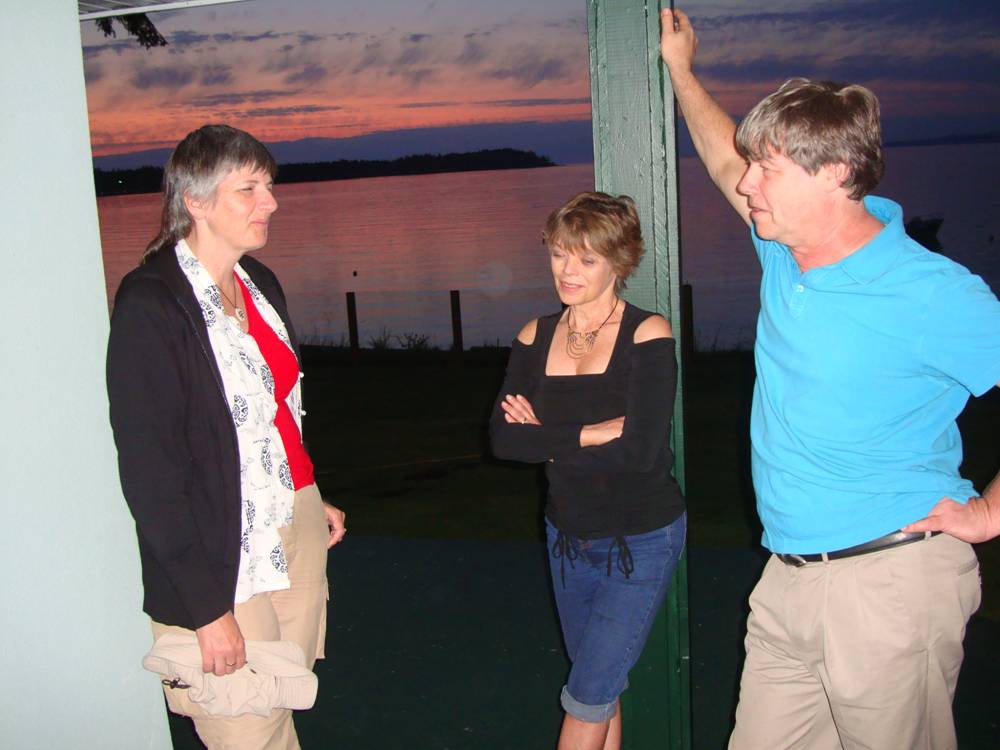 With the sunset over the ocean as a backdrop, party at Peter's, Nanoose, B.C., Canada