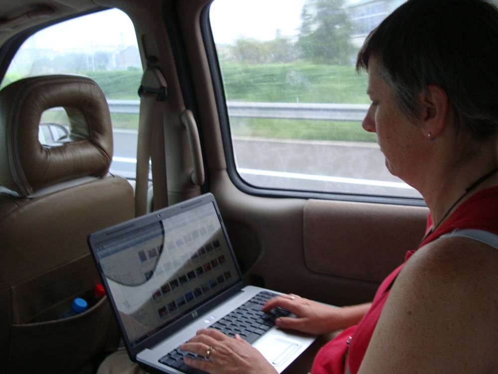 Ruth organizes her pictures on the ride to Jiangnan University, Wuxi, China