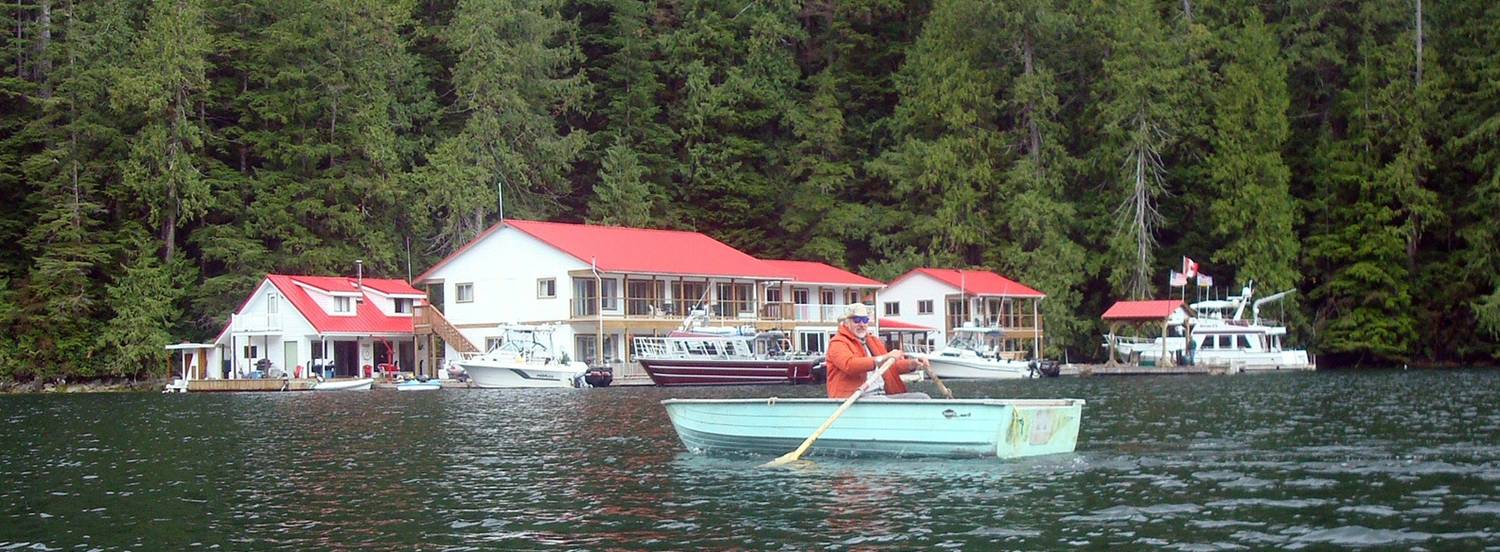 picture:  David Scott in a rowboat in front of Nootka Sound Lodge, Nootka Sound, B.C., Canada