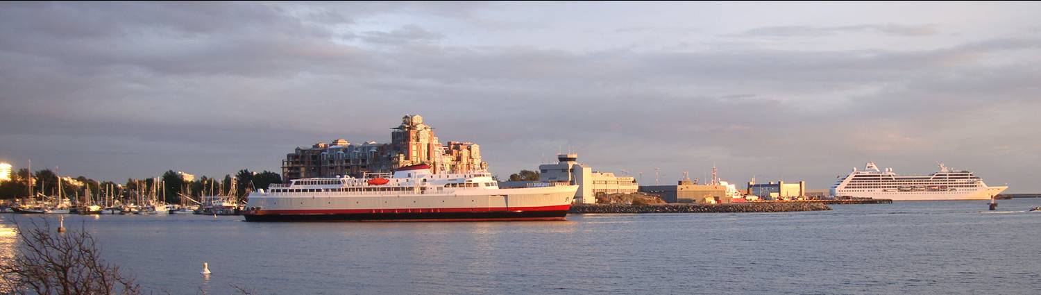 picture: Cruise ships set out from Victoria harbour into the sunset.  Victoria, B.C.