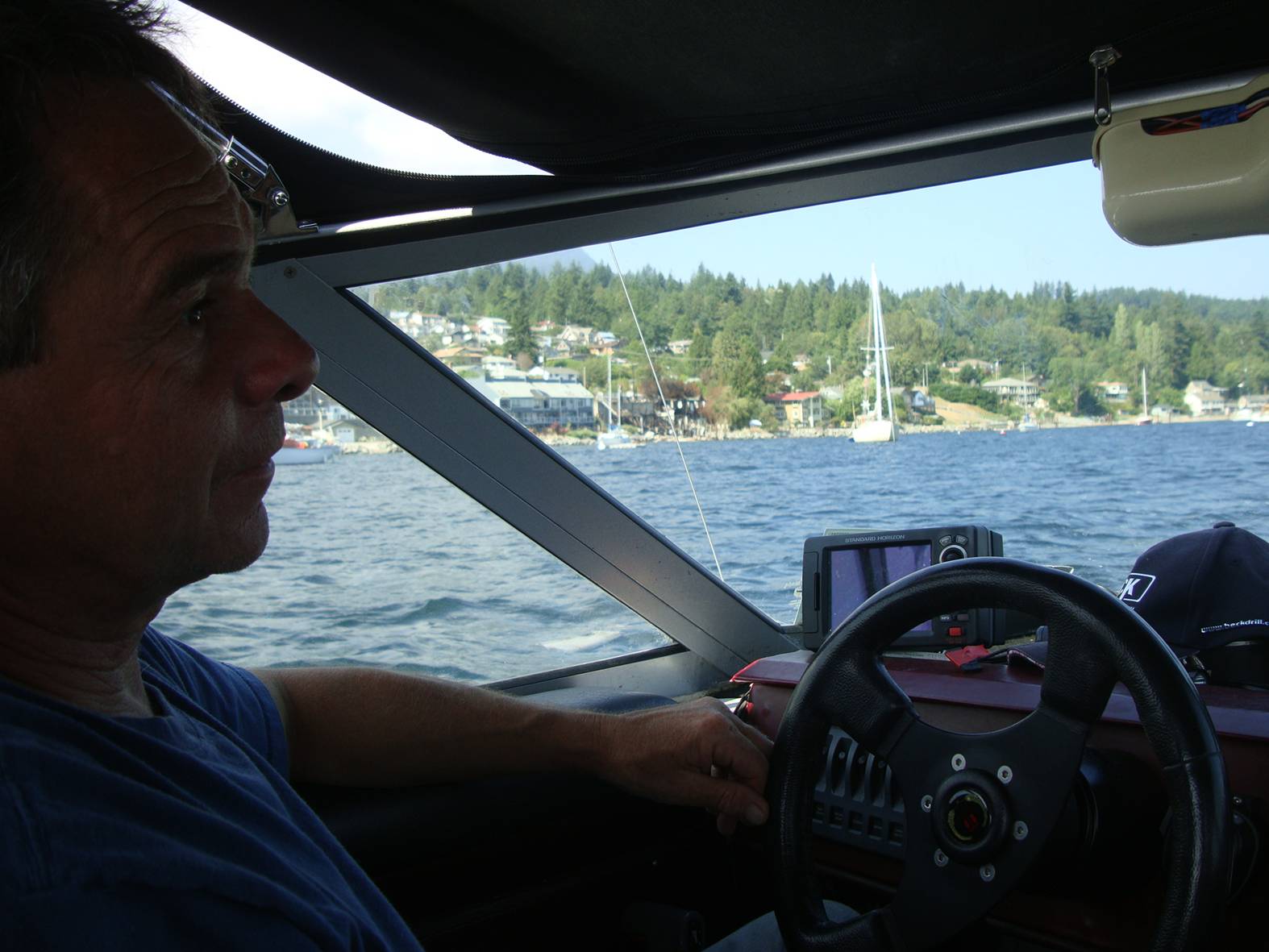 picture: Don at the wheel of his water taxi, Gibson's Landing, B.C.