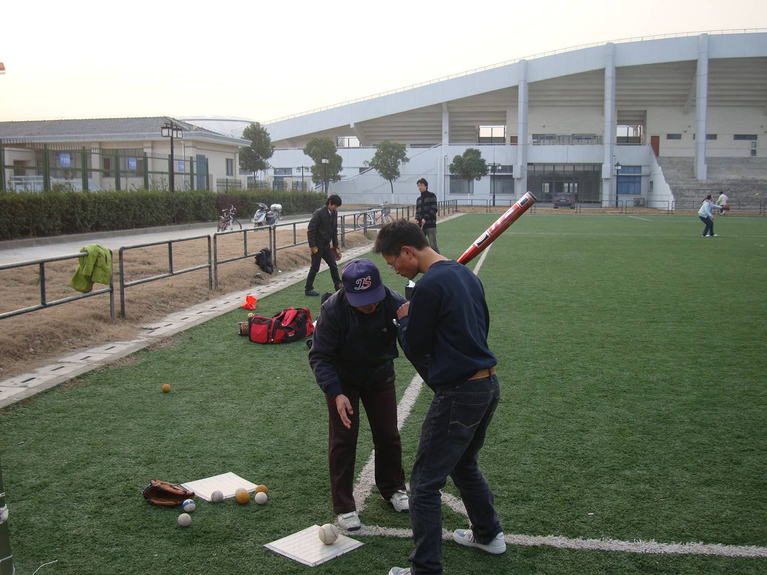 Apparently the placement of feet is important.  Softball coaching, Jiangnan University, Wuxi, China