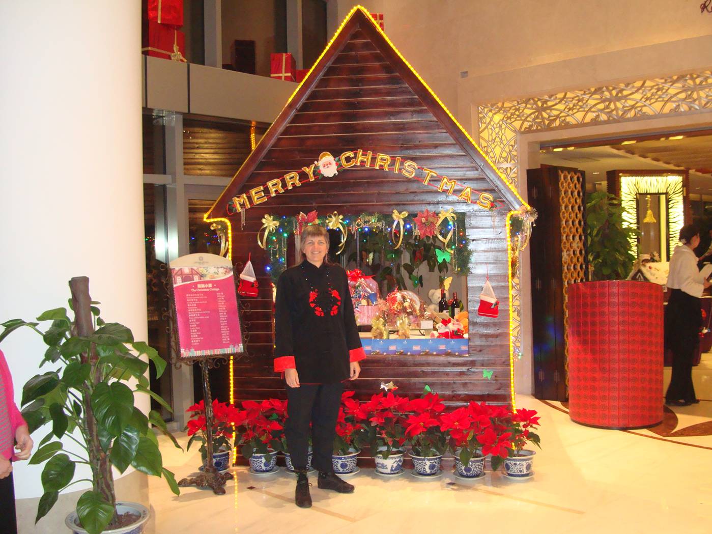 Ruth in front of the Christmas house.  Hu Bin (5 star) Hotel.  Wuxi, China