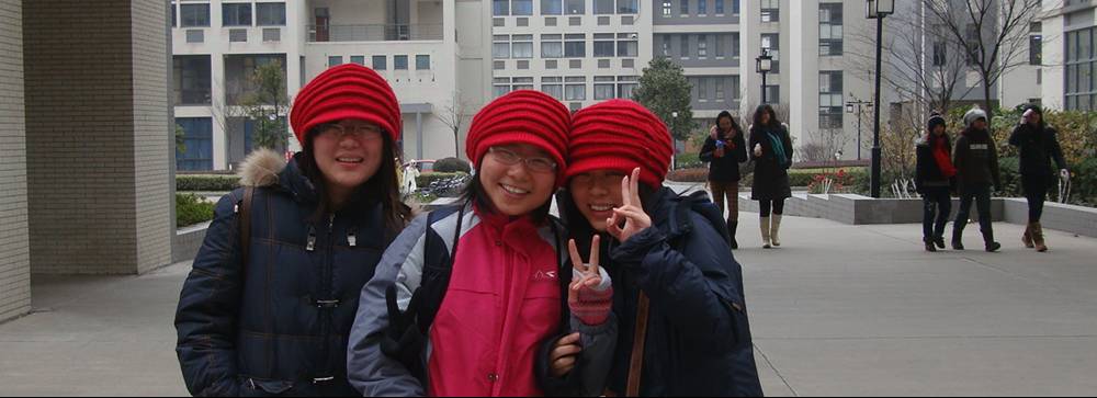 Picture:  I saw these three girls in identical hats and just had to take their picture.  Jiangnan University, Wuxi, China