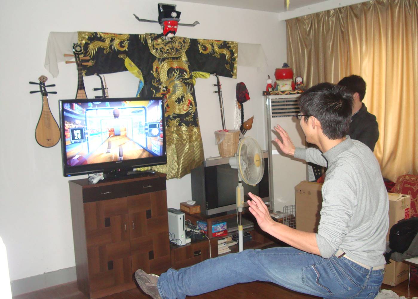 Picture:  A student tries out one of the Kinect games.  Jiangnan University, Wuxi, China