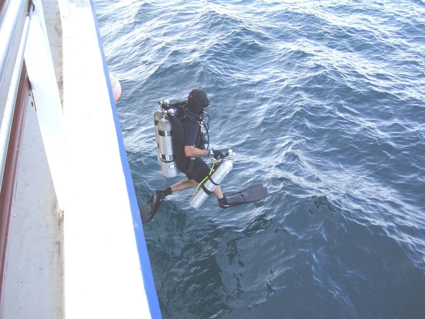 Picture: Doug in mid air on his way to the water for a deep dive.  Phuket Island, Thailand.