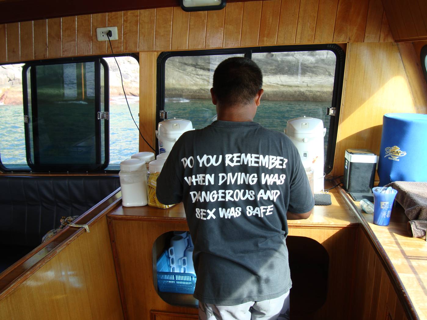 Picture:  Dive Asia crewmember in a very ironic T-shirt.  Dive Asia, Phuket Island, Thailand