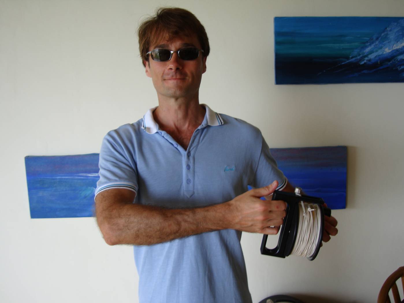 Picture:  Doug with his freshly washed and dried reel of diver surveyor line.  Phuket Island, Thailand