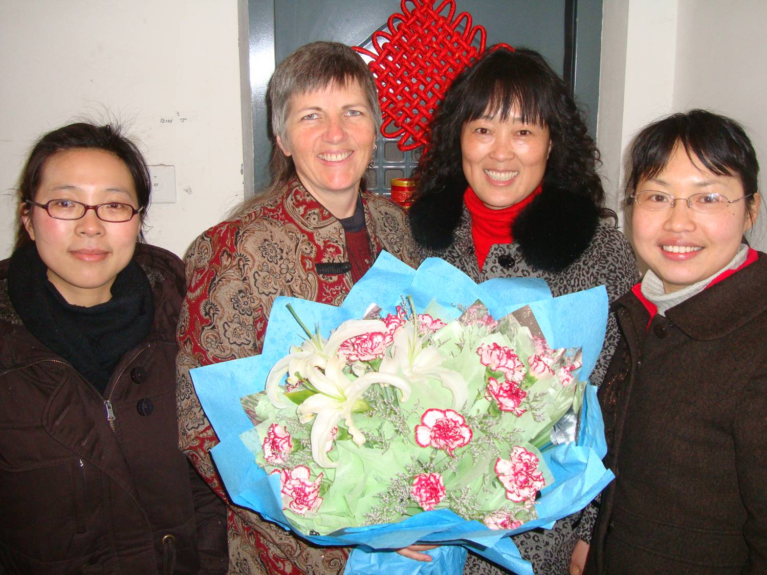 Ruth and the delegation from the administration, lead by Ms. Liu, with the beautiful bouquet for Women's Day.  Jiangnan University, Wuxi, China