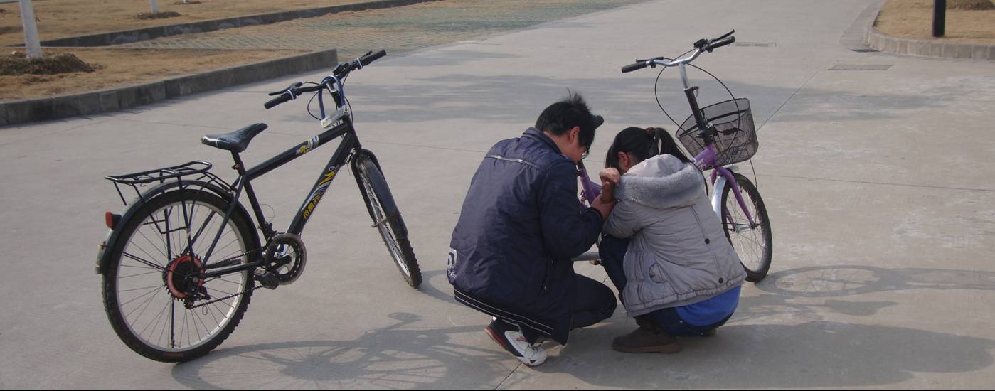 Picture:  Fortunately she only hurt her elbow.  This time.  I sure wish I could get these students to wear helmets.  Working on it.  Jiangnan University, Wuxi, China