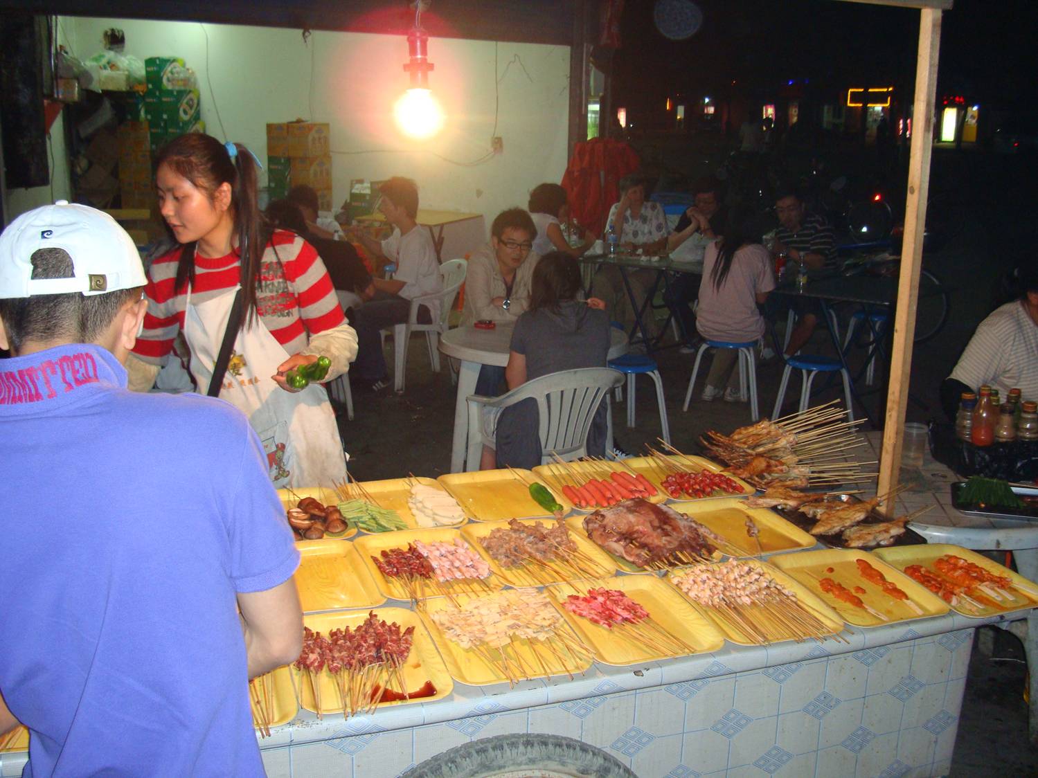 That's our group in the background.  Street food.  Shi Tang Jia, Wuxi,  China