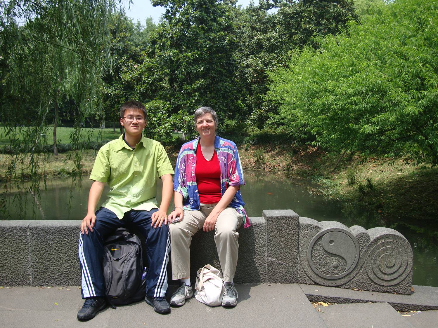 George and Ruth take a break on a bridge.  West Lake Park,  Hangzhou,  China