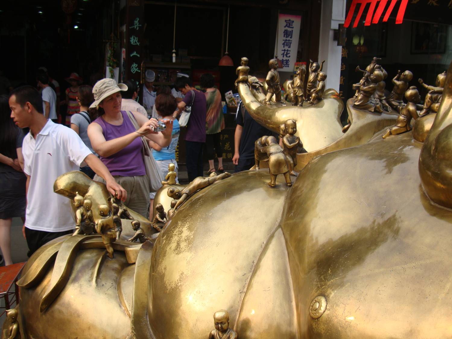 Ruth photographs the giant brass Buddha.  Hangzhou ancient city,  China