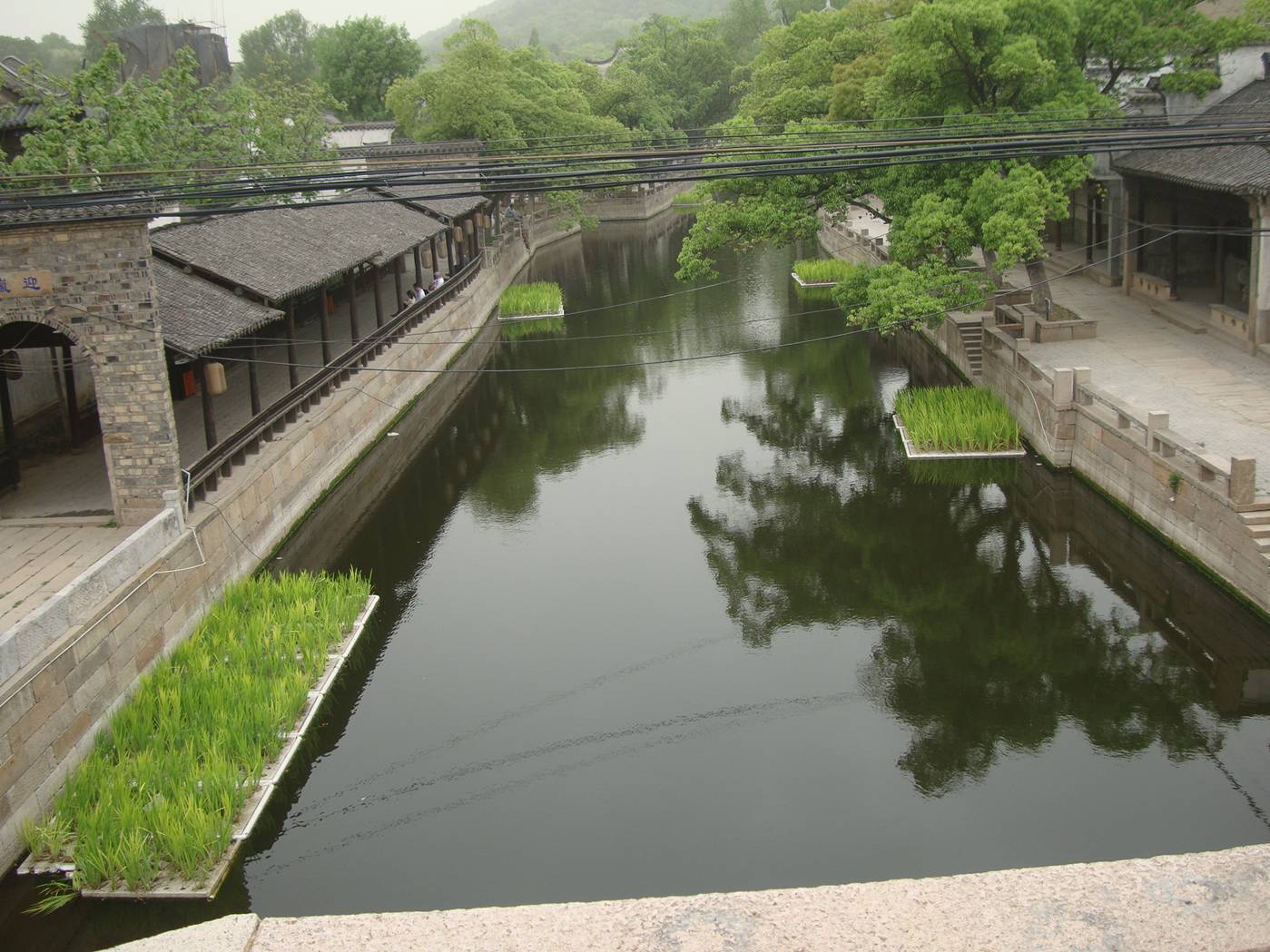 Picture:  Looking West from the bridge and the canal is completed through the renovated ancient city.  Wuxi, China