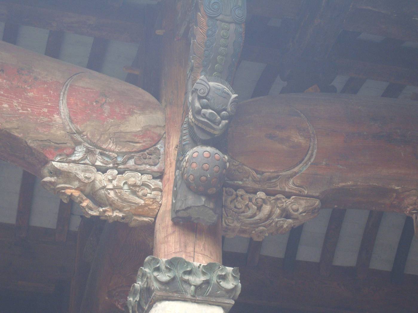 Picture: You miss a lot if you don't look up.  Carved roof support knees in the Wuxi museum.  Wuxi, China