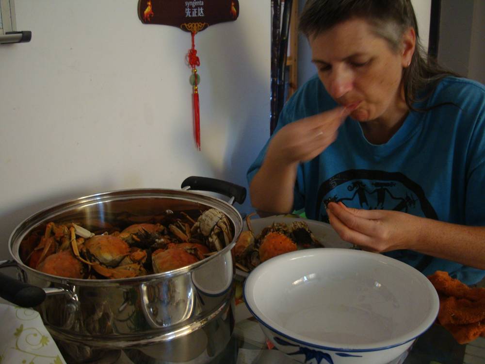 Later that same day...  Ruth digs into the crabs.  Jiangnan University, Wuxi, China