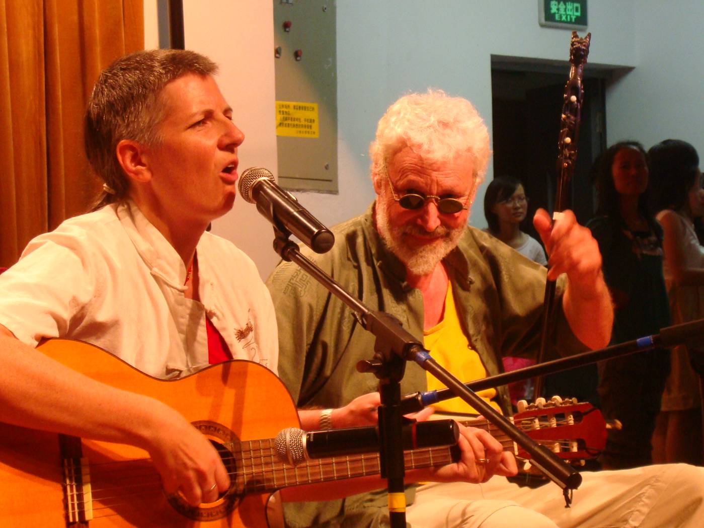 Ruth puts her heart into a Chinese love song while I accompany on the erhu.  The black glasses are an homage to a famous blind street musician, A Bing (Hua Yanjun 华彥君-阿炳, c. 1893-1950) and they always get a laugh.  Jiangnan University, Wuxi, China