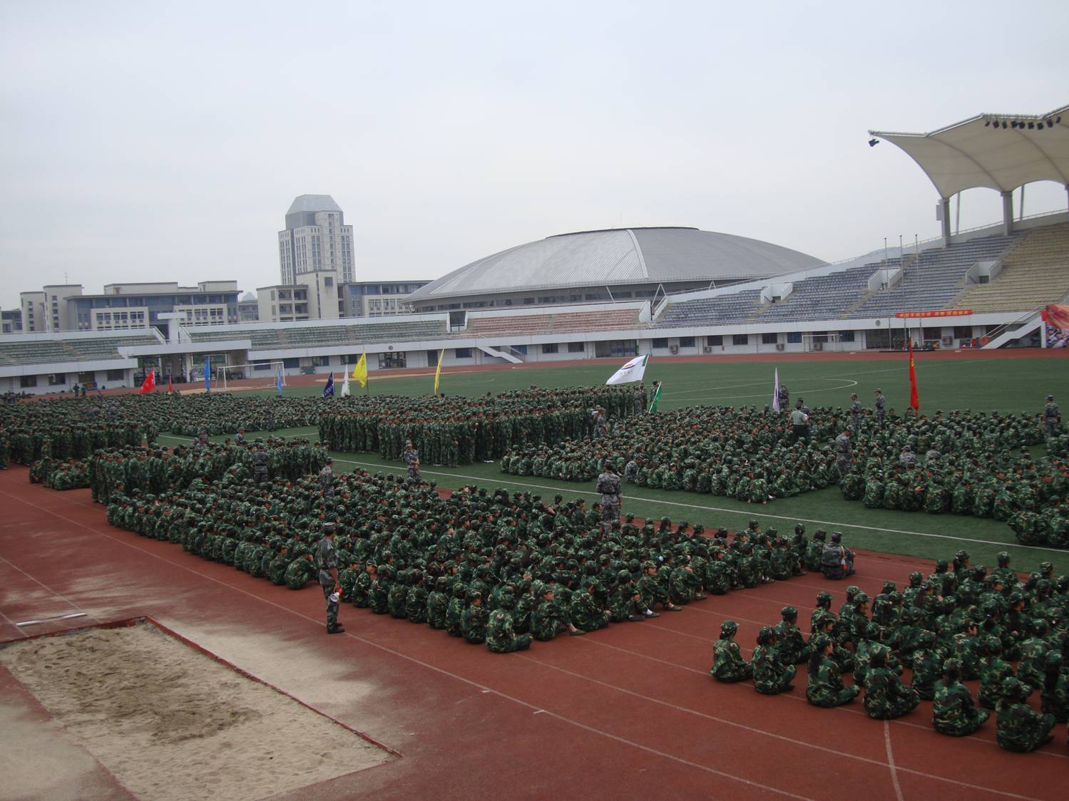 They also get a lot of practice listening to speeches. Freshmen military training, Jiangnan University, Wuxi, China. It's very hot and humid these days, and I don't think those uniforms breath very well.  I feel sorry for these kids. I'm streaming sweat, and I'm not marching in the sun.