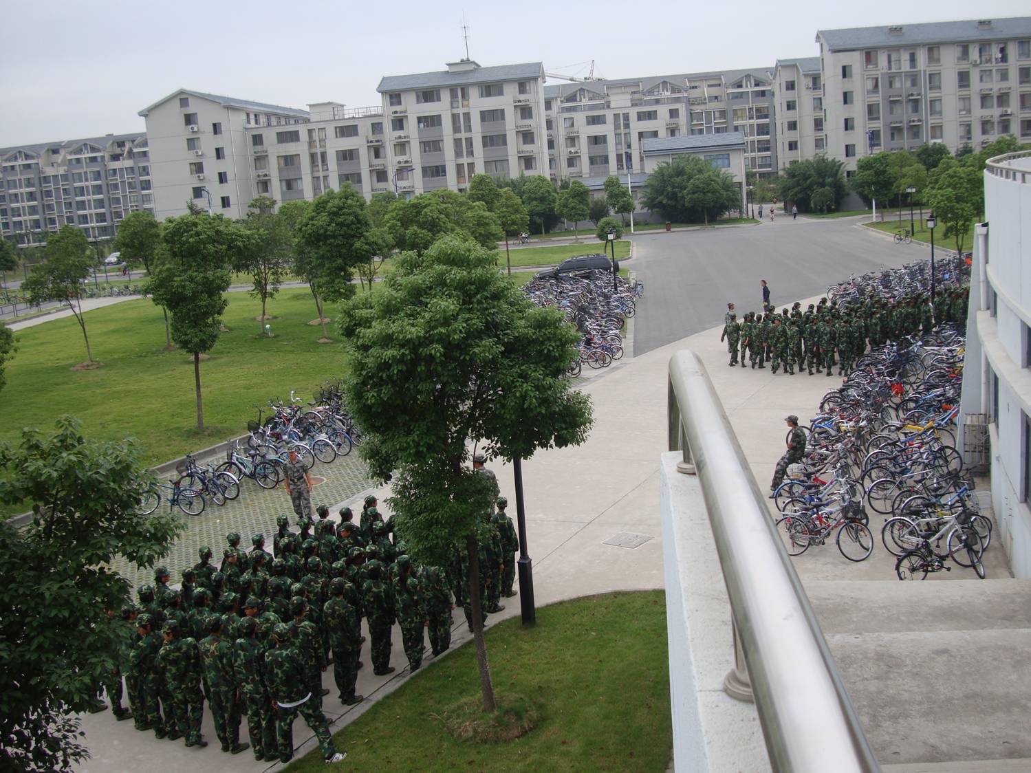 I've also seen them carrying rifles, though I'm not sure they get to actually fire them.  Military training, Jiangnan University, Wuxi, China