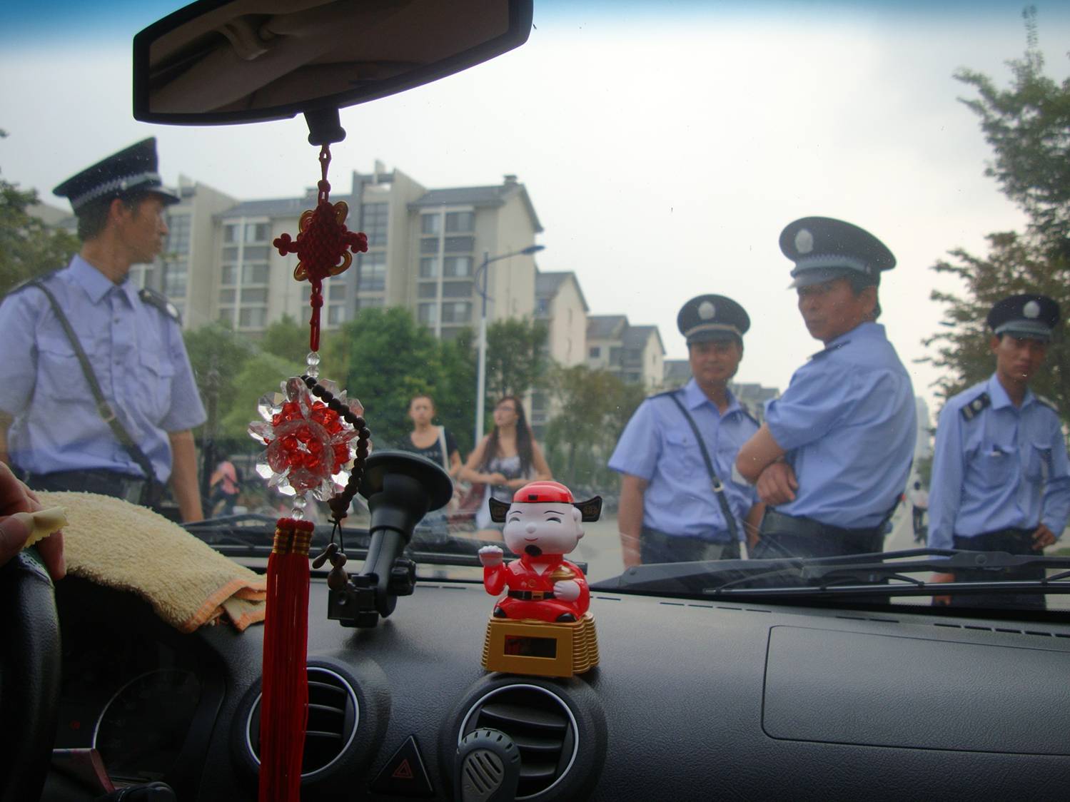 The guards stop my car at the North gate.  I'm trying to learn to be tolerant of such things. They must have their reasons, and if not they certainly have their orders. Jiangnan University, Wuxi, China