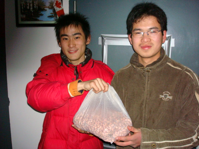 Students bearing gifts.  Lots and lots of peanuts from Wang Rulong's hometown.